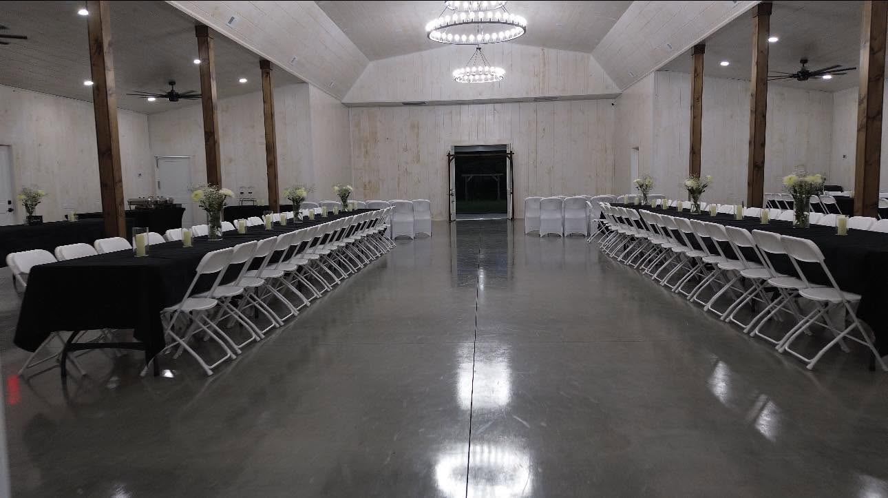 Banquet hall set up with long tables and chandeliers for a corporate or gala event