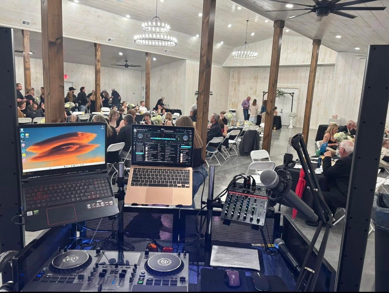 DJ booth set up inside the Mirewood reception hall during a reception